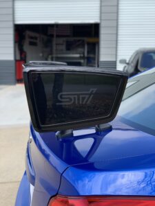 Tail on a blue Subaru